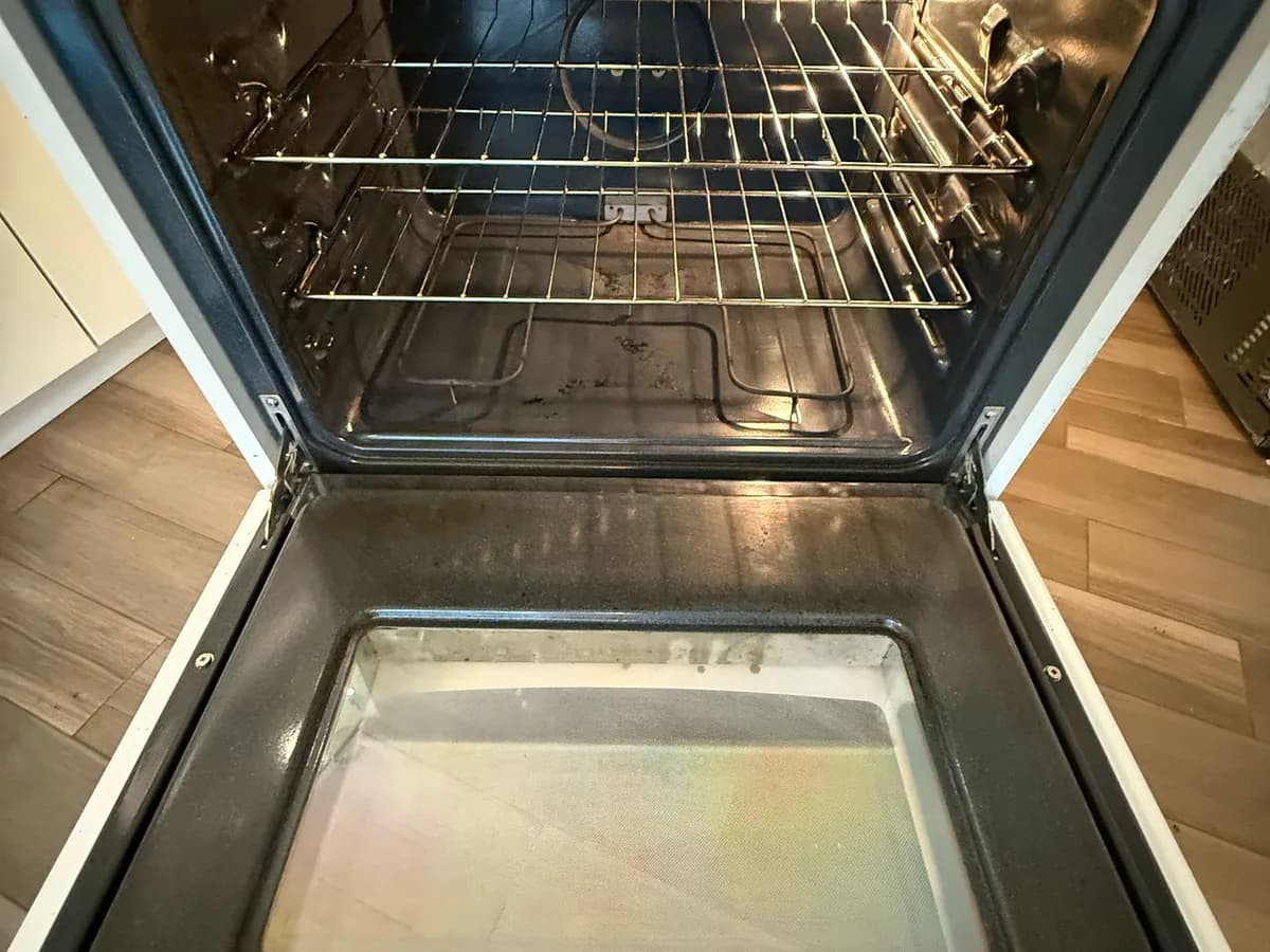 the same oven interior, racks and door with residue removed after property-management cleaning in British Columbia