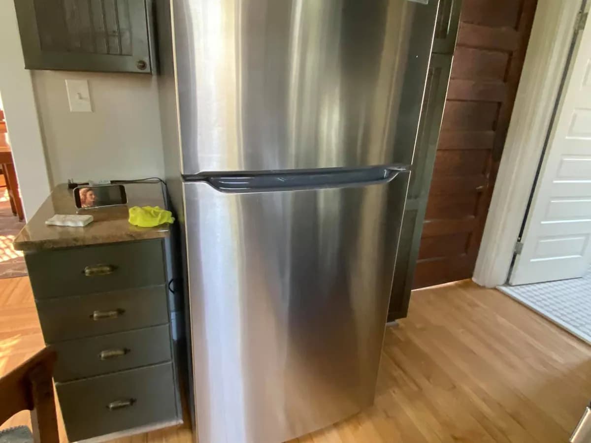 Clean refrigerator exterior after professional kitchen cleaning