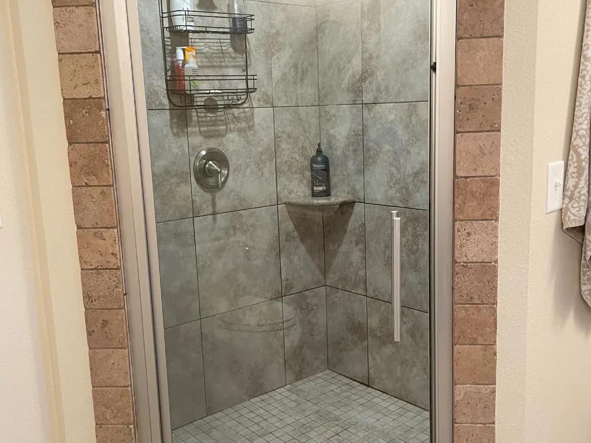 the same shower glass clear enough to see the tiled shower after professional house cleaning